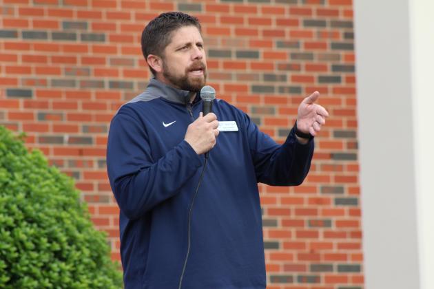 Shawnee Superintendent Dr. Aaron Espolt speaks from the front porch of the Geiger Center at Oklahoma Baptist University during the United in Strength Stroll on April 19. Several other community leaders also spoke before they led a group in the one-mile walk to the YMCA. Countywide &amp; Sun/Natasha Dunagan