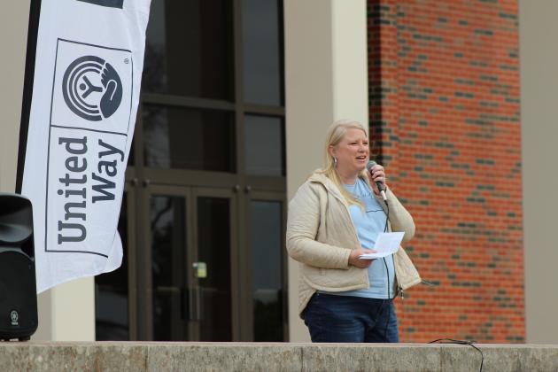 United Way of Pottawatomie County Executive Director Sandy Vanderburg speaks from the front porch of the Geiger Center at Oklahoma Baptist University during the United in Strength Stroll on April 19. Several other community leaders also spoke before they led a group in the one-mile walk to the YMCA. Countywide &amp; Sun/Natasha Dunagan