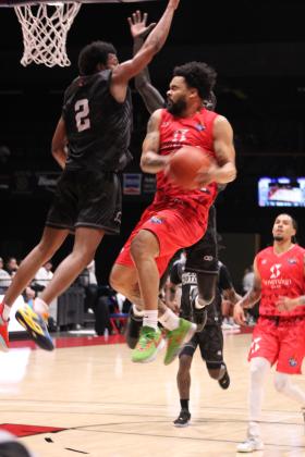 Potawatomi Fire point guard Deshawn Munson is blocked by two Enid Outlaws defenders in the May 4 home game at FireLake Arena. Munson's record of 48 points in one game was broken by his 2023 TBL Co-MVP Chuck Guy, who made 55 points that night. In their 15th straight win this season, the Fire beat the Outlaws, 130-107. Countywide &amp; Sun/Natasha Dunagan