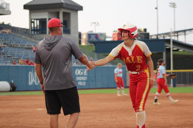 Dale's Kinley Patten shakes hands with Assistant Coach Bryce Clemons after hitting a single in the sixth inning of the Class 4A Slow Pitch State Championship against Silo on April 30. That day, they beat Stroud, 15-1, and Latta, 14-5, but fell to the #4-ranked Silo, 4-14. The Lady Pirates end their season as the Class 4A State Runners-Up, with a record of 33-9.  Countywide &amp; Sun/Natasha Dunagan