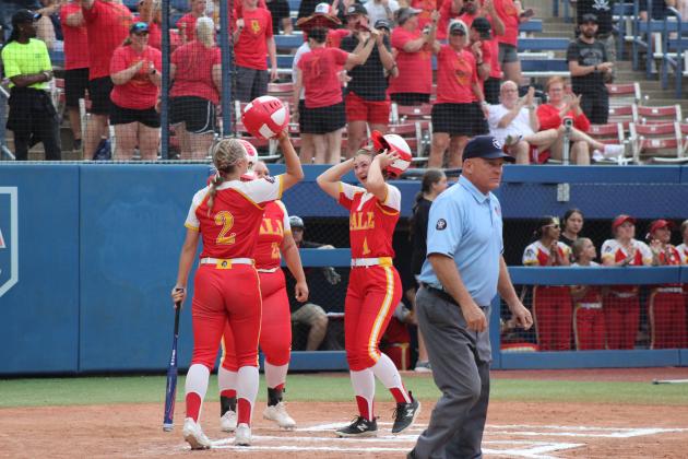 Dale Lady Pirates teammates hit helmets after Heartly Snyder (#1) hit a home run in the first inning of the Class 4A Slow Pitch State Championship on April 30. That day, they beat Stroud, 15-1, and Latta, 14-5, but fell to the #4-ranked Silo, 4-14. The Lady Pirates end their season as the Class 4A State Runners-Up, with a record of 33-9.  Countywide &amp; Sun/Natasha Dunagan