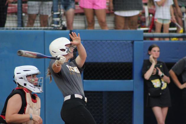 Junior Jessi Hull hits a single.
