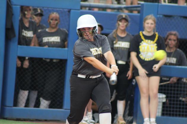 Sophomore Maggie Wilson hits a single.