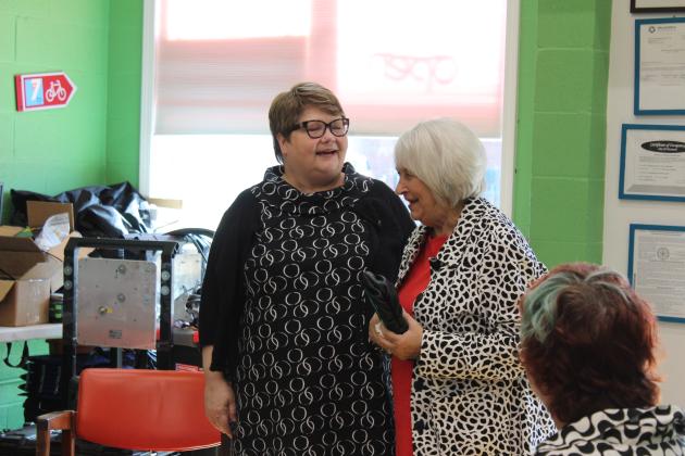 Mary Carter speaks with her junior high typing teacher.