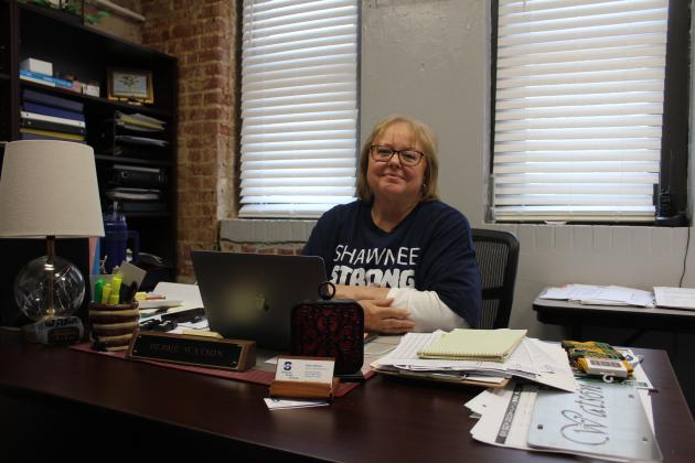 Debra Watson at her desk