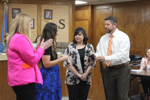 Dr. Espolt presents the Star of the Month Award to Jennifer Panter.