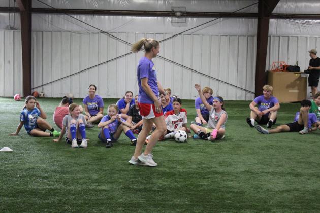 Two-time US Olympic Gold-medalist and U.S. Women’s Soccer Legend Lindsay Tarpley gives demonstration to a crowd of kids.