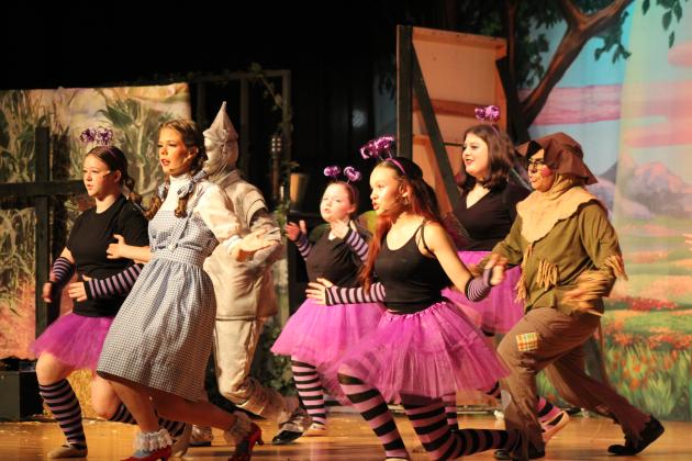 Dorothy (Calyn Harris), Tinman (Brody Johnston), Scarecrow (Jay Ahlstrom), and the Cowardly Lion (Connor Hill, not pictured) are forced to dance by a group of Jitterbugs sent by the Wicked Witch of the West (Aries Stout) during the Tecumseh Middle School and High School production of "The Wizard of Oz" on April 28. "The Jitterbug" was a deleted scene from the movie version. Jitterbugs were played by Lydia Clagg, Leila Elliott, Camryn Medley, Lily Opela, Serenity Shackelford and Amiah Vermillion.