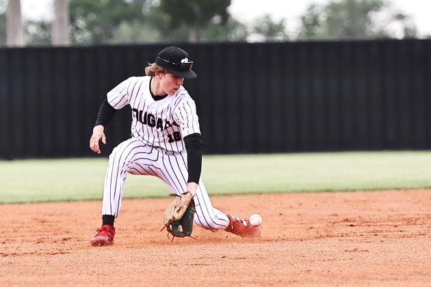 North Rock Creek's Hunter Bertram makes the stop at short stop. NRC took on Perkins-Tryon Monday in a district game. The Cougars came up short, losing 12-7.