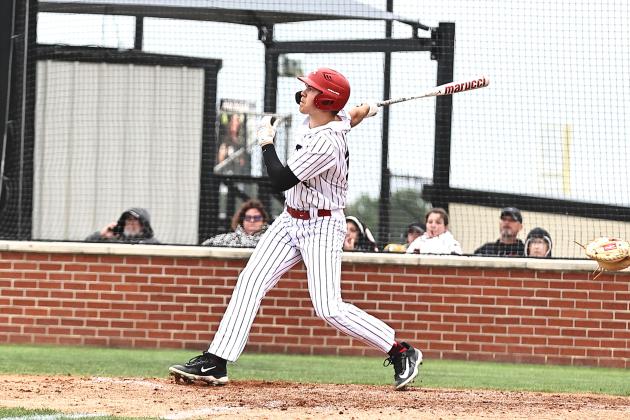 North Rock Creek's Jace Plumb watches the ball go over the fence for a 3 run HR.