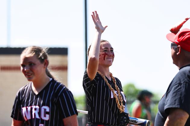 North Rock Creek's Hadley Gates celebrates her homerun with a high five from Coach Cox. The Lady Cougars claimed District title and will began Regionals last week.