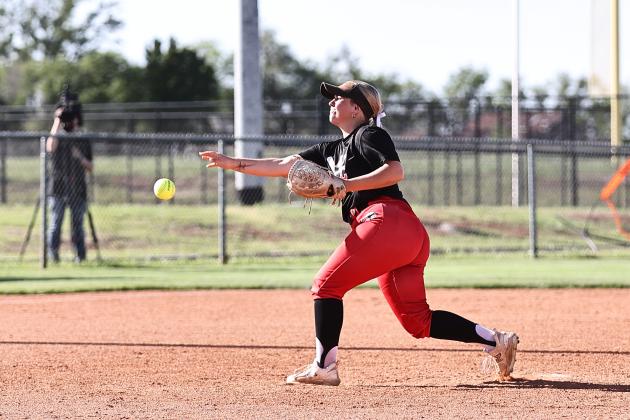 North Rock Creek's Raynee Bass hurls the pitch across home.