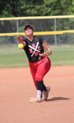 North Rock Creek pitcher Raynee Bass lofts the ball toward home during the Class 5A Slow Pitch State Semifinals with Tecumseh on April 30. The #1-ranked Lady Cougars won in their Quarterfinals with Perkins-Tryon, 10-9, but lost to the #2-ranked Lady Savages in the Semifinals, 7-13. Their record this season is 33-9. Countywide &amp; Sun/Natasha Dunagan