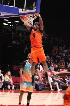 Potawatomi Fire small forward K.D. Moore makes a slam dunk to round out the second quarter against the Santa Ana Thunder on April 25. Adding to their winning streak, the Fire won, 120-88. Countywide &amp; Sun/Natasha Dunagan