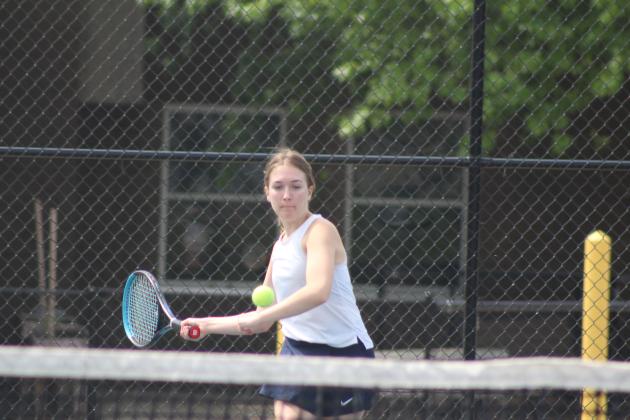 Shawnee junior Emelia Bronson keeps her eye on the ball, as part of the #1 Doubles team with senior Bella Koepke, at the Shawnee NGB Tournament on April 26. There were 16 schools at the girls event and 10 schools the next day at the boys event, due to weather. Countywide &amp; Sun/Natasha Dunagan