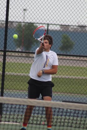 As part of the #1 Doubles team with Jaxon Kuhn, Tecumseh junior Noah Henson serves against an Ardmore team at the Shawnee NGB Tournament on April 27.  Kuhn and Henson placed fifth out of 10 schools to win the boys consolation bracket, said THS Tennis Coach Jennifer McKnight. The #2 Doubles team of Ted Belshe and Jessy Thoma placed fourth. Countywide &amp; Sun/Natasha Dunagan