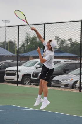 Tecumseh senior Jaxon Kuhn serves while playing in the #1 Doubles with junior Noah Henson against an Ardmore team at the Shawnee NGB Tournament on April 27.  Kuhn and Henson placed fifth out of 10 schools to win the boys consolation bracket, said THS Tennis Coach Jennifer McKnight. The #2 Doubles team of Ted Belshe and Jessy Thoma placed fourth. Countywide &amp; Sun/Natasha Dunagan
