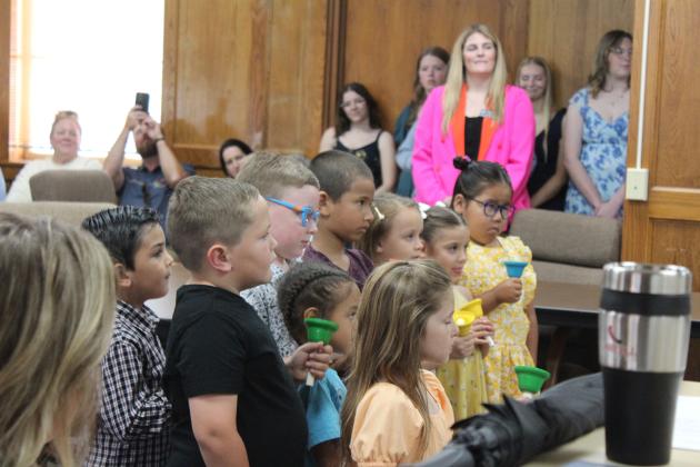 Students from Shawnee Early Childhood Center play hand bells to “Ode to Joy” for the regular Shawnee Board of Education meeting on May 14. Countywide &amp; Sun/Natasha Dunagan