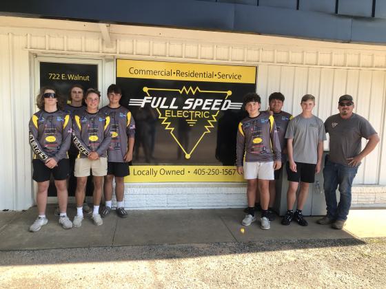 Members of the Tecumseh High School Fishing Teams pose in front of one of their sponsoring locations, Full Speed Electric, with owner Cal McKiddy, far right. Members of the teams are, not in order, Carter Hadsall, Maddox Dickson, Daxton Stewart, Madden McKiddy, Wyatt Cosper, Brody Westcott, Bryscon Cosper and Coby Frank, not pictured. Two out of the three teams are preparing to compete on Lake Hartwell in South Carolina for the national championship, June 19-22. Photo provided by Janell Mitchell.