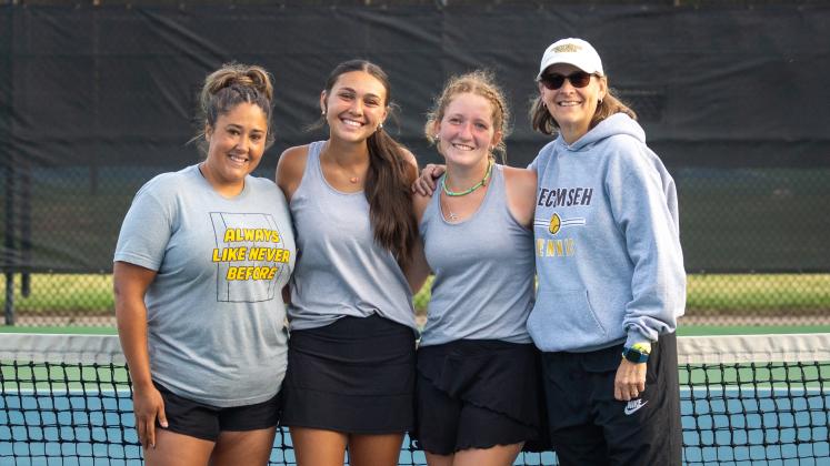 Tecumseh Assistant Tennis Coach Megan Laughlin, #1 Doubles Team Jalee Meyers and Laycee Thoma, and Head Tennis Coach Jennifer McKnight pose at the Class 4A Girls State Tennis Tournament on May 4 at the OKC Tennis Center. They placed seventh out of the state. Photo provided.