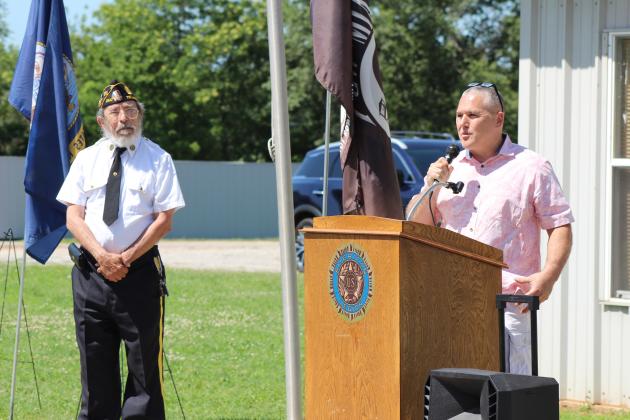 Rev. Paul Fletcher, of Northridge Church of Christ in Shawnee, speaks during the Memorial Day service at Tecumseh Cemetery on May 27. State Senator Shane Jett also spoke, as well as Post Adjutant Bill Gammage, far left. Countywide &amp; Sun/Natasha Dunagan