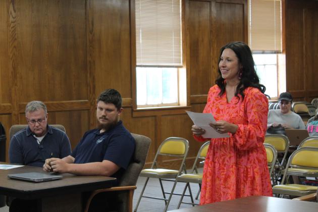 Sequoyah Elementary Principal Kim Paxson reads her letter of resignation to the Shawnee Board of Education at the regular meeting on June 3. Countywide &amp; Sun/Natasha Dunagan