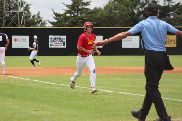 Dale's Jax Odell runs home in a summer game with Tecumseh during the John (Rocky) Barrett Classic at Tecumseh High School on June 20. The senior games were held at Shawnee High School. Countywide &amp; Sun/Natasha Dunagan