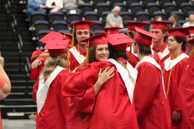 The 39 Dale graduates share a "moment of reflection" during their commencement on May 13. Valedictorians Emma Collins and Ethan Lindenbaum spoke at the event. Countywide &amp; Sun/Natasha Dunagan