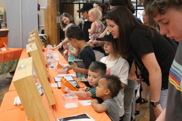 Shawnee Library's First Annual Bugfest featured OSU's traveling entomology show "Insect Adventure," which included 12 display cases of bug collections and about 25 live insects and arachnids, enjoyed here by several children and parents. Bugfest also offered a honey tasting, crafts and story time. Countywide &amp; Sun/Natasha Dunagan