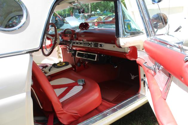 The interior decor of a 1956 Ford Thunderbird, owned by Gerald Montgomery of Shawnee, includes a record player, fuzzy dice and a hula girl. It was one of many cars at the 37th Annual Knights Auto Club Car Show on June 22 at Briscoe Boy Scout/Rotary Park. Countywide &amp; Sun/Natasha Dunagan