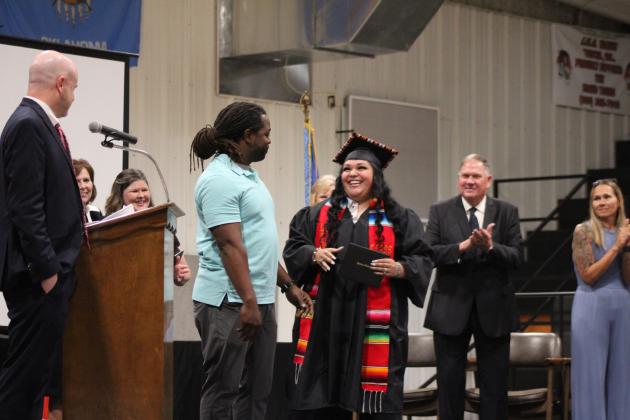 Maud Softball and Football Coach Royce Street presents Genesis Thorpe with her diploma on May 17, to the applause of board of education members and administration. Street later said in an email that Thorpe is "a kid I've known for a while that's just really special to me." Thorpe requested in February that he be the one to present her diploma. Maud graduated 17 seniors this year. Micah House was the valedictorian, and Cooper Nance was the salutatorian. Countywide &amp; Sun/Natasha Dunagan