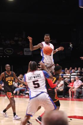 Potawatomi Fire Forward Ricky Artis II makes a jump pass to teammate Ruston Hayward in the third quarter of The Basketball League National Finals at FireLake Arena on June 23. They topped off their undefeated third season by beating the St. Louis Griffins, 119-108, becoming the first TBL team to win back-to-back national titles. Countywide &amp; Sun/Natasha Dunagan