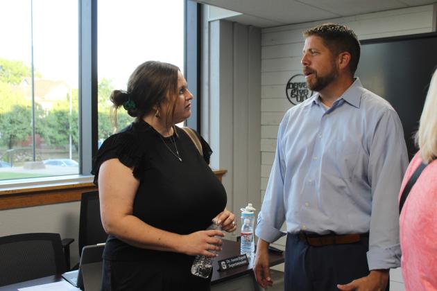 Shawnee Public Schools Superintendent Dr. Aaron Espolt speaks with the new Communications and Library Services Coordinator Amanda Teape Johnson after the Board of Education meeting on June 24. Countywide &amp; Sun/Natasha Dunagan