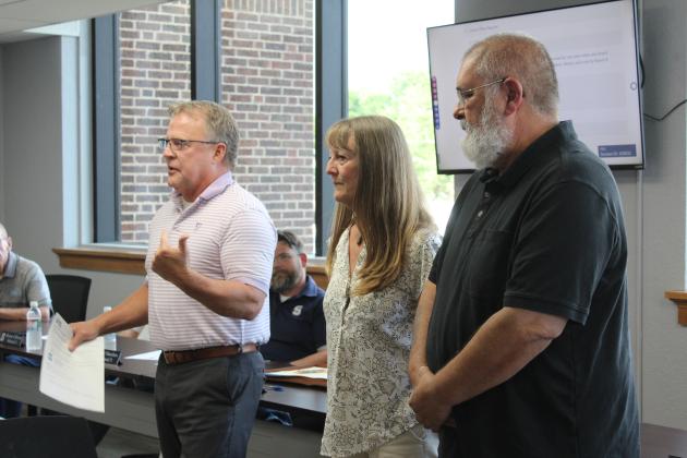 Shawnee Public Schools Director of Operations Ron Stearns speaks about two awards received from the Oklahoma Association of Pupil Transportation, during the June 24 Board of Education meeting. Sherry Gibson was named the OAPT Support Employee of the Year, and Ron Reser is the OAPT Bus Driver of the Year. Countywide &amp; Sun/Natasha Dunagan