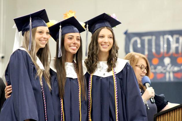Asher Graduates Magi Melton, Payton Leba and Alexis Johnston are recognized for their athletic achievements by Counselor Shawna Magby during graduation on May 11. Countywide &amp; Sun/Natasha Dunagan