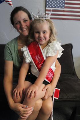 Autumn Hughes, 5, sits with her mother Lauren Hughes, both of Tecumseh. Autumn won four out of five titles at the Oklahoma Our Diamond Miss pageant on June 7-9 and is raising money to attend the national competition in Chickasha, July 13-17. Countywide &amp; Sun/Natasha Dunagan