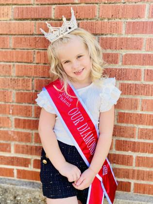 Autumn Hughes, 5, of Tecumseh, poses in her Oklahoma Tiny State Talent sash and crown on June 27. Hughes won four of five "Tiny" titles at the Oklahoma Our Diamond Miss pageant recently and is planning to compete in the national competition, July 13-17. Countywide &amp; Sun/Julie Talton
