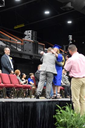 Joey Ginn steps up to hug his daughter, Ashlee, as she walks across the stage at Bethel’s graduation on May 18th.  Ginn was the commencement speaker and spoke about having Growth, Resilience, Integrity and Tenacity (GRIT). Countywide &amp; Sun/Julie Talton