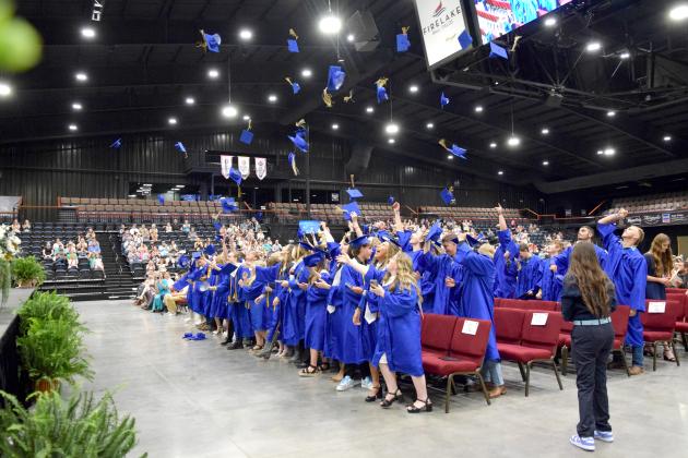 Bethel Seniors toss their caps in the air after offically being declared graduates at the May 18th ceremony held at Firelake Arena.  Countywide &amp; Sun/Julie Talton