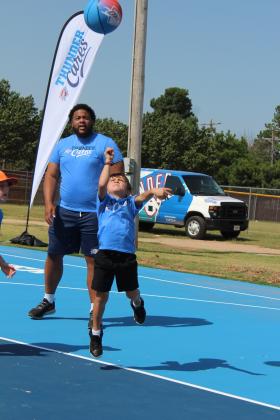 Aaron Nash, 6, of Bethel, makes his shot on the newly-resurfaced Bethel Community Court, July 15. Nash has visited the court before its facelift and has played youth league basketball for two years, said his mother. Countywide &amp; Sun/Natasha Dunagan