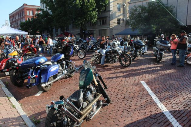 Motorcyclists cruise Bell Street, along with spectators, amidst the hundreds of bikes and trikes to view during the Bikes on Bell Shawnee Bike Night on July 18. Part of the proceeds from Bikes on Bell went to the Shawnee High School Band Boosters, according to a Facebook post. With live music, vendors and food trucks, the next event will be held on Aug. 15, 6-10 pm. For more information, visit their Facebook page. Countywide &amp; Sun/Natasha Dunagan
