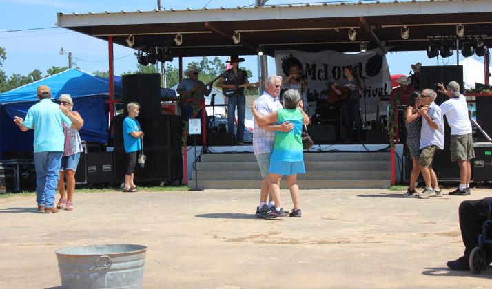 Despite the heat, three couples dance as the McKedy Band plays classic country and a few original songs at the McLoud Blackberry Festival on July 13. Other musical acts during the two-day festival included the McTeggert Irish Dancers, Blackwater Smoke, the Luke Haley Band and the Wise Guys. Countywide &amp; Sun/Natasha Dunagan
