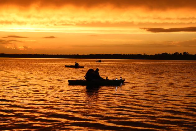 The sun sets over Shawnee Twin Lake #2 during the Fifth Annual Pott. County Kayak Club 4th of July Glow Paddle, just before a rainy evening. The group just recently reached 2,000 members on its Facebook page, and has been growing since its formation in Sept. 2019. Countywide &amp; Sun/Natasha Dunagan