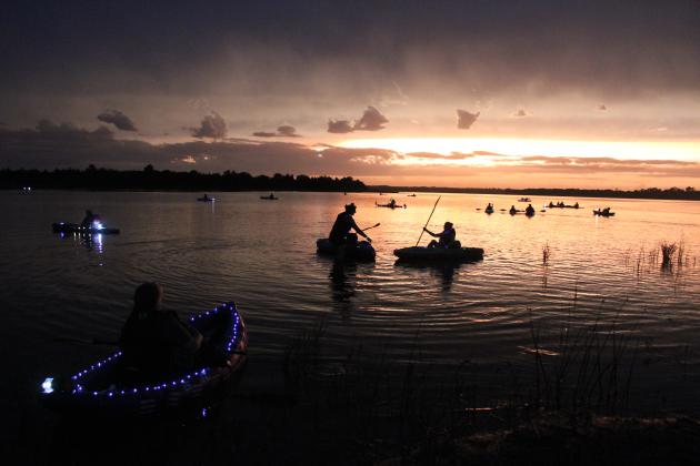 Members of the Pott. County Kayak Club and other boating clubs participate in the Fifth Annual 4th of July Glow Paddle, as the sun sets on Shawnee Twin Lake #2.