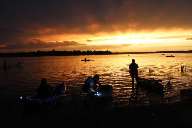 As the sun sets over Shawnee Twin Lake #2, Denise Manson, Barton Gilcrease, of Asher, and Denoda Martin, of Shawnee, participate in the Fifth Annual Pott. County Kayak Club 4th of July Glow Paddle. The group just recently reached 2,000 members on its Facebook page, and has been growing since its formation in Sept. 2019. Martin was among those who began the club after borrowing a kayak and falling in love with the activity. Countywide &amp; Sun/Natasha Dunagan