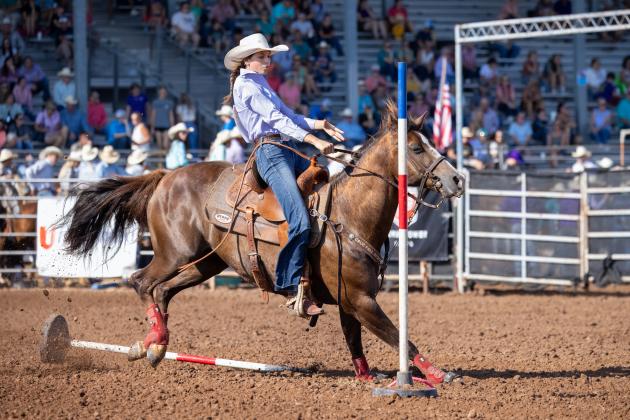 Bella Branham, of Tecumseh, knocks down a pole during her July 10 morning run at the International Finals Youth Rodeo. Photo courtesy of Richelle Treece.