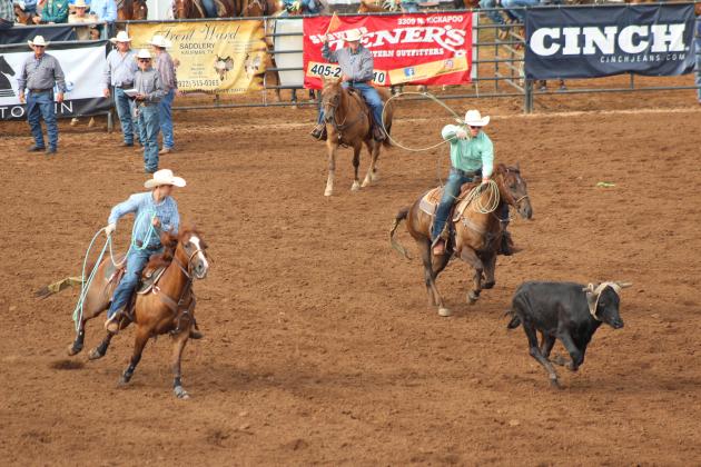 Landen and Hayden Youngblood, of Shawnee, compete in team roping.