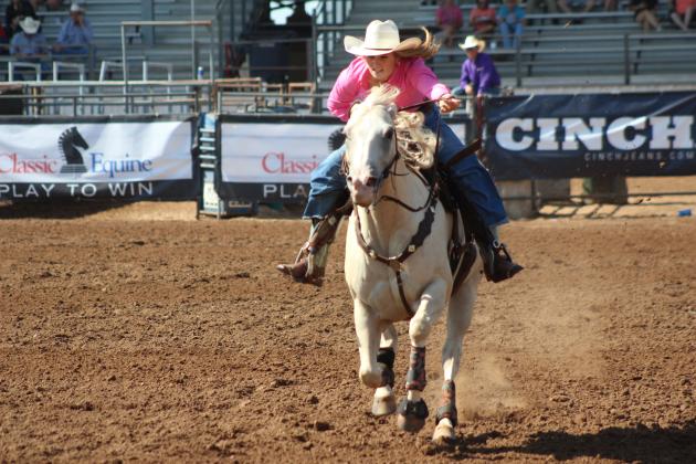 Cassidy Wilson, of Shawnee, dashes to the end of her barrel race, July 10, at the International Finals Youth Rodeo. Countywide &amp; Sun/Natasha Dunagan