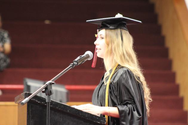 Macomb Valedictorian Jolie Jones addresses her classmates, reminding them of their class motto: "Just because you don't know what you want yet, it doesn't mean that there's nothing to want," by Emily Henry. The Salutatorian was Siana Powell. Countywide &amp; Sun/Natasha Dunagan