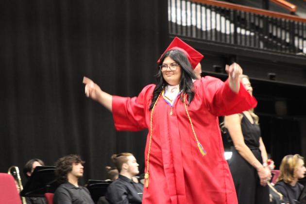 McLoud Graduate Audrey Easter celebrates getting her diploma at graduation on May 18. Countywide &amp; Sun/Natasha Dunagan